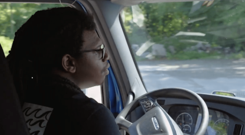 over the shoulder image of a person driving